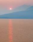 USA, Washington State, Seabeck. Smoky sunset over Mt. Jupiter and Hood Canal. Art Print